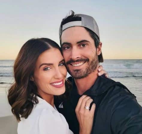 Ben cutting and wife, Erin Holland
